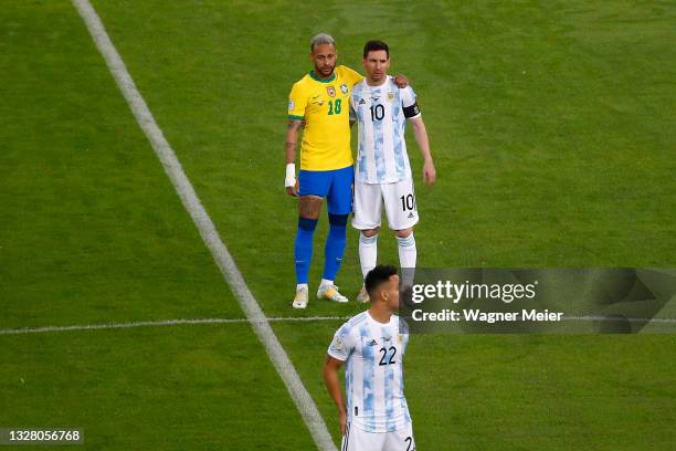 Neymar Jr. Of Brazil hugs Lionel Messi of Argentina as Lautaro Martinez of Argentina prepares for kick off prior to the final of Copa America Brazil...