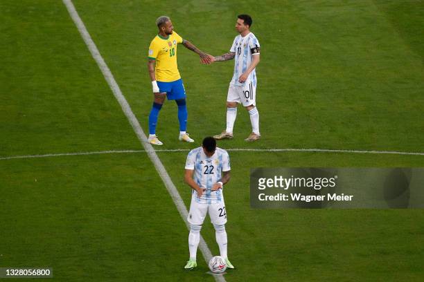 Neymar Jr. Of Brazil greets Lionel Messi of Argentina as Lautaro Martinez of Argentina prepares for kick off prior to the final of Copa America...