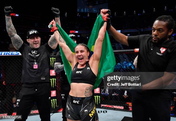 Jennifer Maia of Brazil reacts after her victory over Jessica Eye in their flyweight fight during the UFC 264 event at T-Mobile Arena on July 10,...