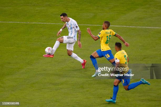 Angel Di Maria of Argentina shoots on target to score the the first goal of his team during the final of Copa America Brazil 2021 between Brazil and...