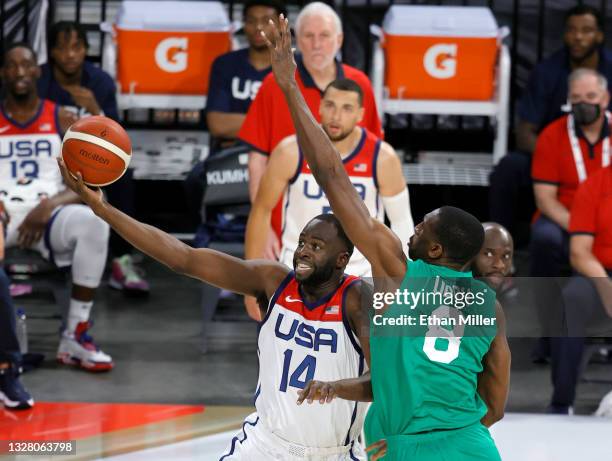 Draymond Green of the United States drives to the basket against Ekpe Udoh of Nigeria during an exhibition game at Michelob ULTRA Arena ahead of the...