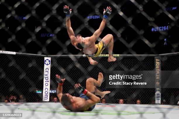 Michel Pereira of Brazil flips over Niko Price in their welterweight bout during UFC 264: Poirier v McGregor 3 at T-Mobile Arena on July 10, 2021 in...