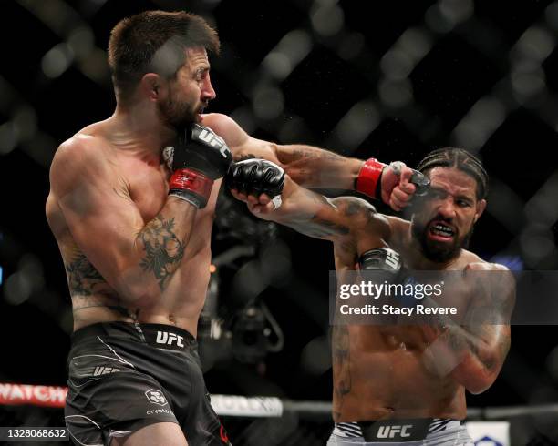 Carlos Condit and Max Griffin exchange punches in the second round in their welterweight bout during UFC 264: Poirier v McGregor 3 at T-Mobile Arena...