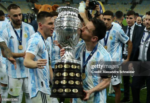 Lionel Messi of Argentina kisses the trophy as he celebrates with teammates after winning the final of Copa America Brazil 2021 between Brazil and...