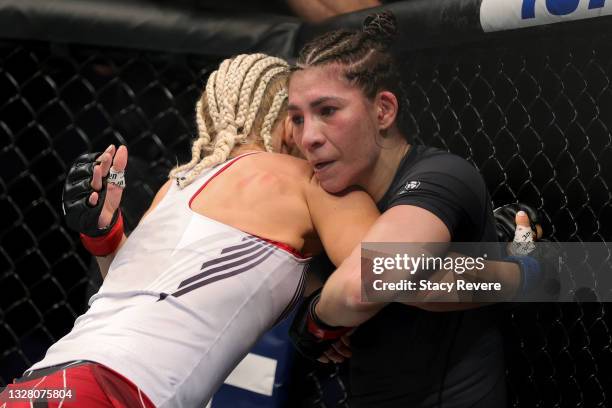 Yana Kunitskaya of Russia and Irene Aldana of Mexico grapple in the first round in their catchweight bout during UFC 264: Poirier v McGregor 3 at...