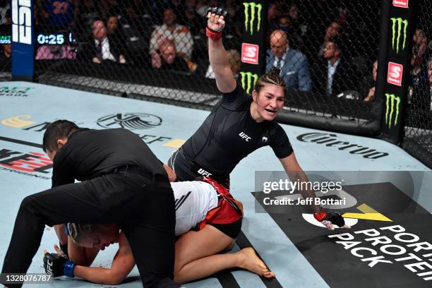 Irene Aldana of Mexico reacts after her TKO victory over Yana Kunitskaya of Russia in their bantamweight fight during the UFC 264 event at T-Mobile...