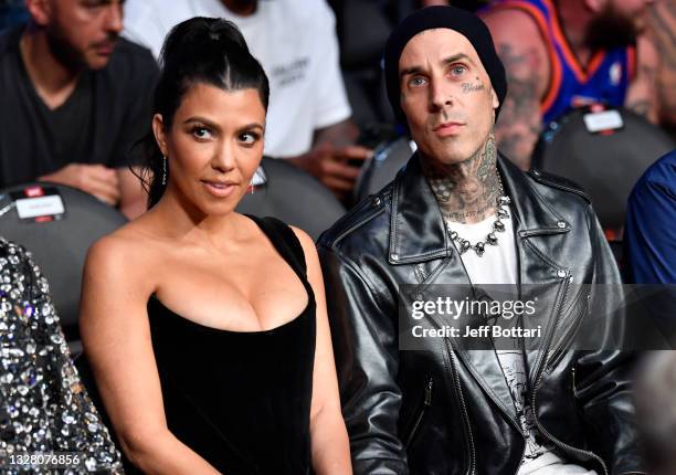 Kourtney Kardashian and Travis Barker are seen in attendance during the UFC 264 event at T-Mobile Arena on July 10, 2021 in Las Vegas, Nevada.