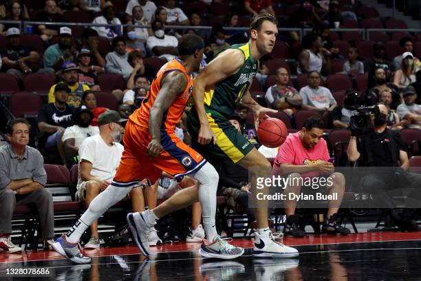 Spencer Hawes of the Ball Hogs dribbles the ball while being guarded by Mario Chalmers of the 3's Company during BIG3 - Week One at the Orleans Arena...