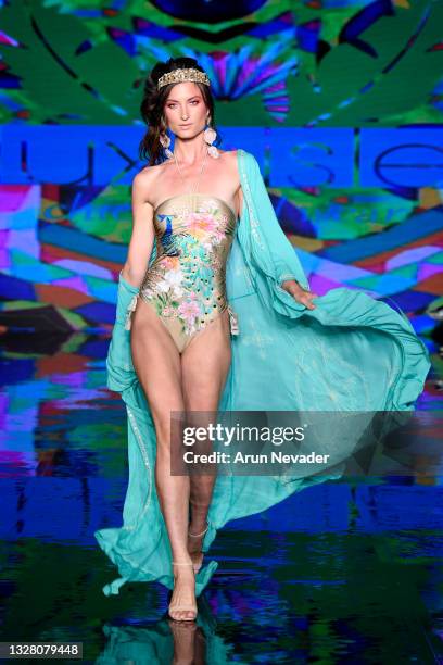 Model walks the runway at the Luxe Isle Show during Miami Swim Week Powered By Art Hearts Fashion at Faena Forum on July 10, 2021 in Miami Beach,...