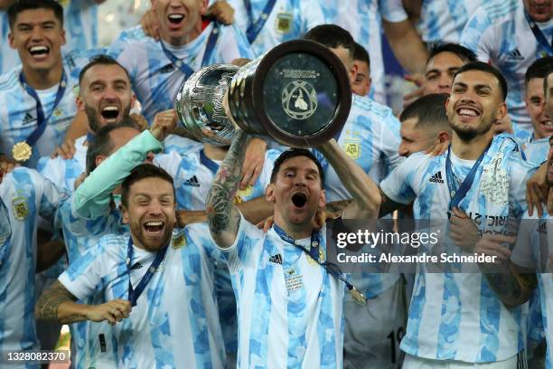 Lionel Messi of Argentina lifts the trophy with teammates after winning the final of Copa America Brazil 2021 between Brazil and Argentina at...