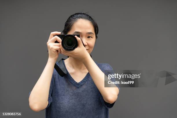 women photographer photographing - asian photographer stock pictures, royalty-free photos & images