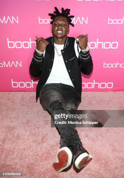 Guest poses backstage during boohoo First Ever Runway Show during Miami Swim Week Paraiso Miami Beach at The Villa Casa Casuarina on July 10, 2021 in...