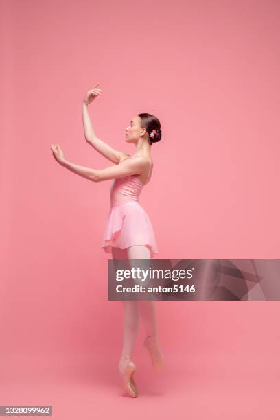 young beautiful graceful ballet dancer, ballerina dancing isolated on pink studio background. art, motion, action, flexibility, inspiration concept. - pink shoe bildbanksfoton och bilder
