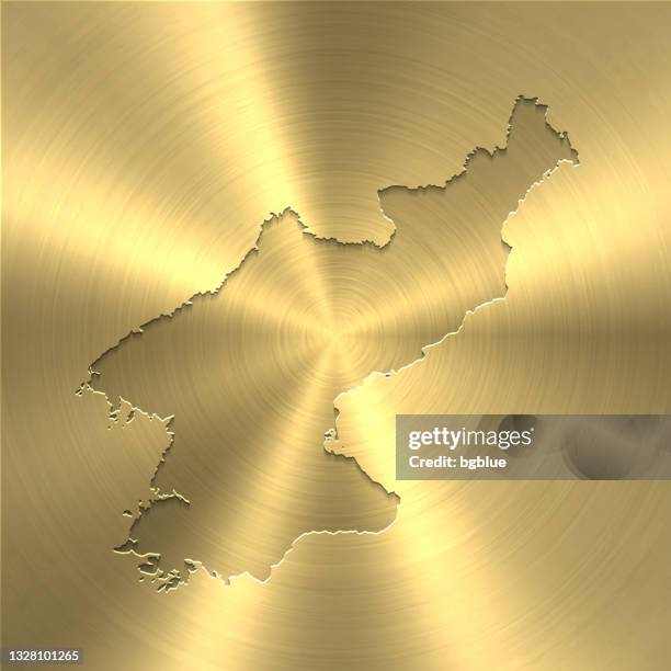 stockillustraties, clipart, cartoons en iconen met north korea map on gold background - circular brushed metal texture - north korea