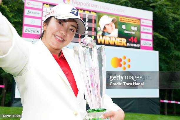 Kotone Hori of Japan imitates the selfie after winning the tournament following the final round of the the Nipponham Ladies Classic at Katsura Golf...