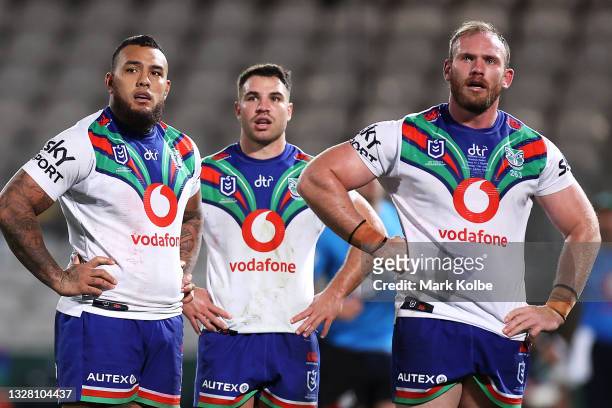 Addin Fonua-Blake, Sean O'Sullivan and Matthew Lodge of the Warriors looks dejected as tghey watch the big screen during the round 17 NRL match...