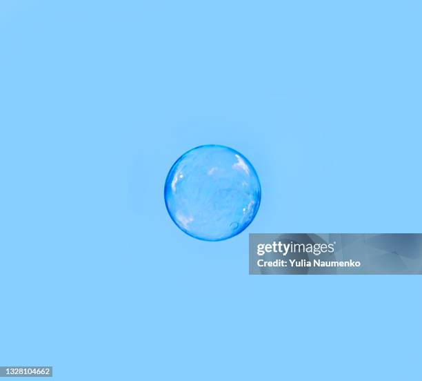 soap bubbles on a blue background - water sphere stock pictures, royalty-free photos & images