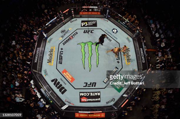 An overhead view of the Octagon as Conor McGregor of Ireland and Dustin Poirier exchange punches during the UFC 264 event at T-Mobile Arena on July...