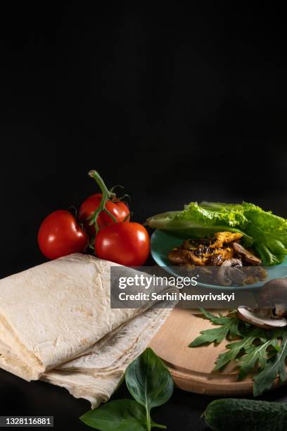 georgian lavash and shawarma ingredients. cooking concept. baking and fast food. mushrooms, cheese, grilled meat, tomato and cucumber. vegetables and sauce. vertical photo. copy space - lavash stock pictures, royalty-free photos & images