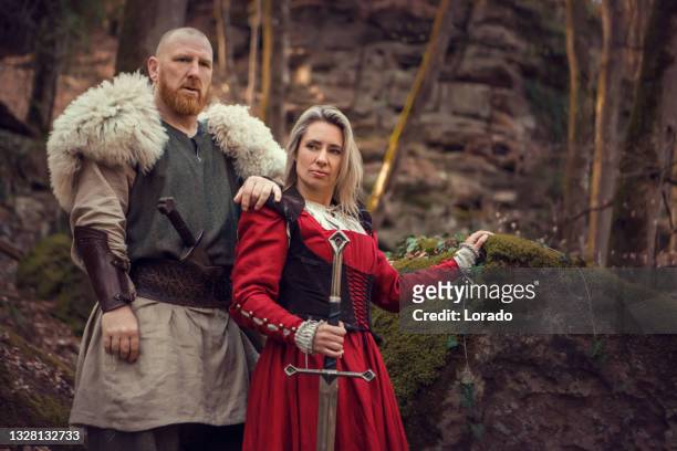 portrait of beautiful blonde fantasy viking couple outdoors - viking stock pictures, royalty-free photos & images