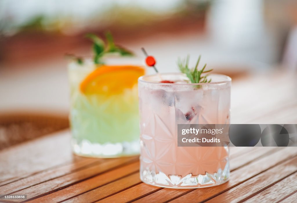 Refreshing Cocktails on Wooden Table