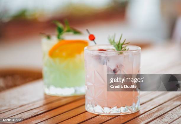 refreshing cocktails on wooden table - tequila drink stock pictures, royalty-free photos & images