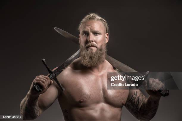 weapon wielding viking warrior in studio shot - viking bildbanksfoton och bilder