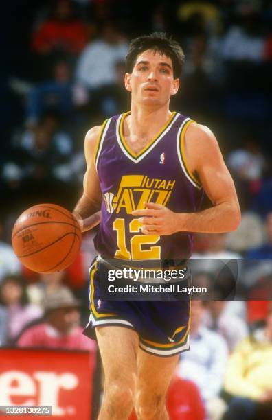 John Stockton of the Utah Jazz dribbles up court during a NBA basketball game against the Washington Bullets on December 2, 1989 at the Capital...