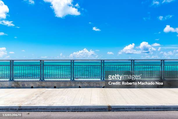 bridge over the sea in bahamas - grand bahama stock pictures, royalty-free photos & images