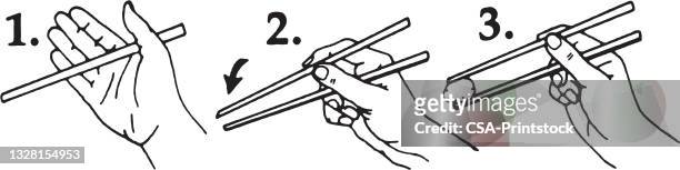 chopsticks diagram - holding chopsticks stock illustrations