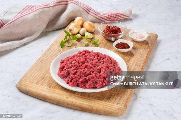 ground beef composition on white marble - ingredients on white ストックフォトと画像