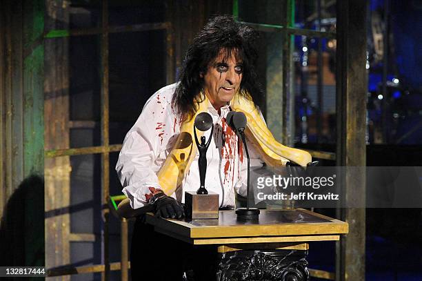 Inductee Alice Cooper poses with a snake and accepts his award onstage at the 26th annual Rock and Roll Hall of Fame Induction Ceremony at The...