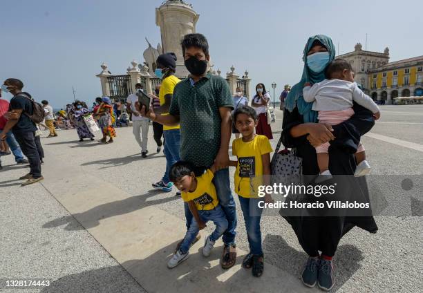 Bangladeshi family takes part in the demonstration in Praça do Comercio to protest against current practices by SEF related to immigrants trying to...