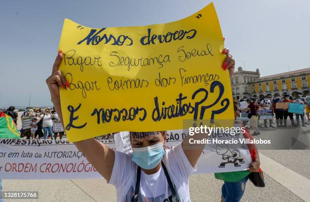 Demonstrators gather in Praça do Comercio to protest against current practices by SEF related to immigrants trying to get their First Residence...