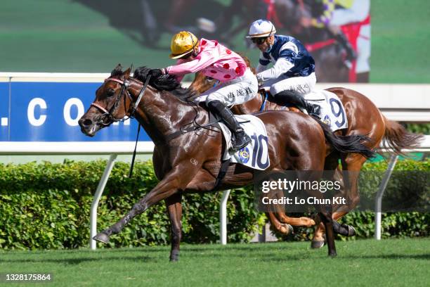 Jockey Harry Bentley riding Preciousship wins the Race 8 The Sha Tin Mile Trophy at Sha Tin Racecourse on July 11, 2021 in Hong Kong. Preciousship...