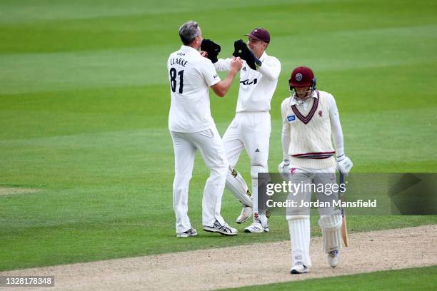 Rikki Clarke of Surrey celebrates with Jamie Smith of Surrey after dismissing George Bartlett of Somerset during day one of the LV= Insurance County...