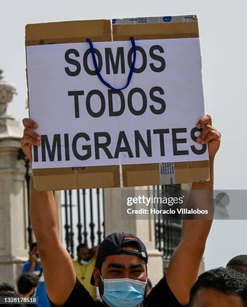 Demonstrators gather in Praça do Comercio to protest against current practices by SEF related to immigrants trying to get their First Residence...