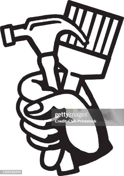 hand holding hammer and paintbrush - hammer stock illustrations