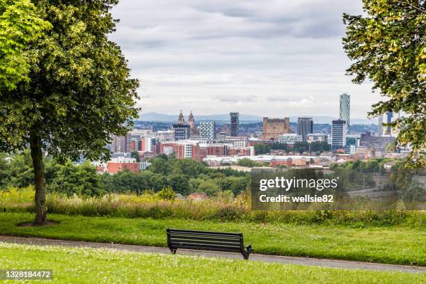 bench overlooking liverpool - liverpool uk stock pictures, royalty-free photos & images