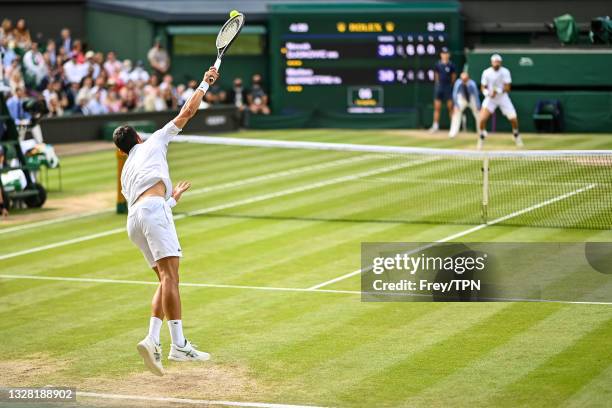 Novak Djokovic of Serbia serves against Mateo Berrettini of Italy in the final of the gentlemen's singles during Day Thirteen of The Championships -...