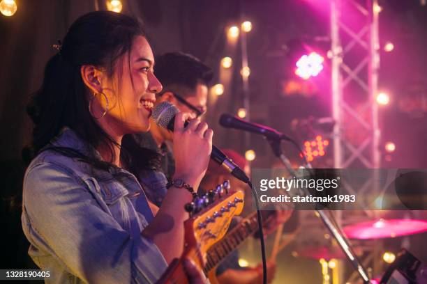 musicians in concert. - pop music concert stock pictures, royalty-free photos & images