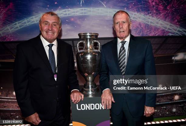 Former England Internationals, Peter Shilton and Sir Geoff Hurst pose for a photograph alongside The Henri Delaunay Trophy prior to the UEFA Euro...