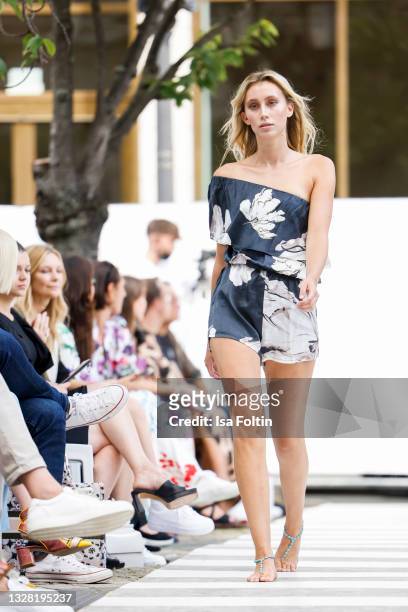 Model walks the runway during the Llobycats show as part of the first Frankfurt Fashion Week Spring/Summer 2022 at Open Air Runway Sofitel Frankfurt...