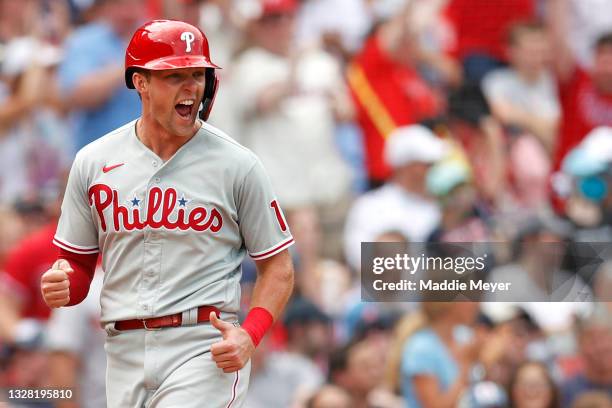 Rhys Hoskins of the Philadelphia Phillies celebrates running towards home after Ronald Torreyes hit a three run home run against the Boston Red Sox...