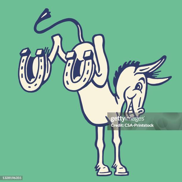 kicking donkey with horseshoes - horseshoe luck stock illustrations