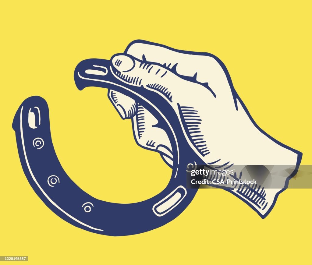 Hand Holding a Horseshoe