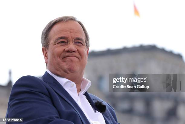 Armin Laschet, chancellor candidate of the German Christian Democrats , arrives for the annual ARD television summer interview near the Reichstag on...