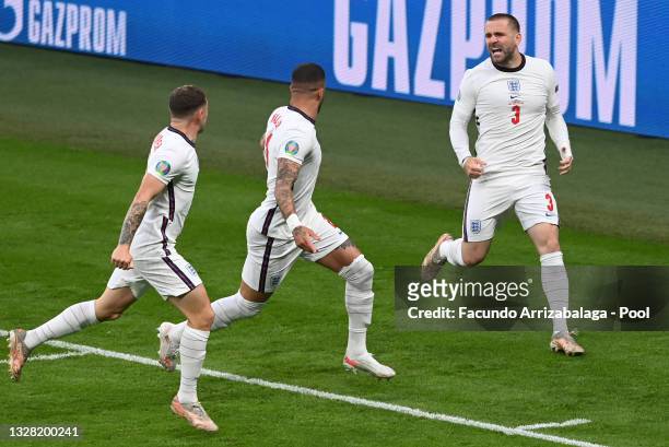 Luke Shaw of England celebrates with teammates Kieran Trippier and Kyle Walker after scoring their team's first goal during the UEFA Euro 2020...