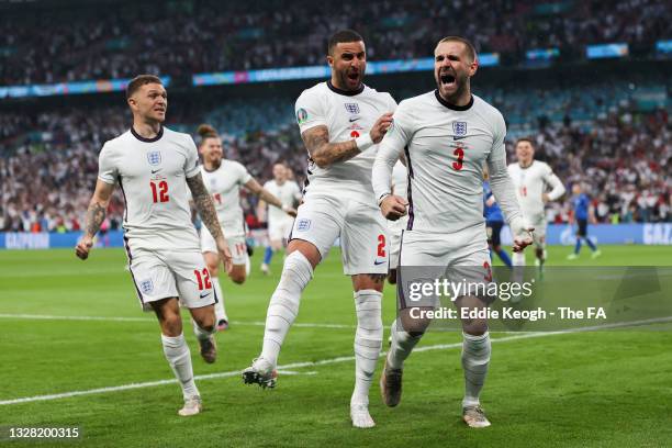 Luke Shaw of England celebrates with teammate Kyle Walker after scoring their team's first goal during the UEFA Euro 2020 Championship Final between...