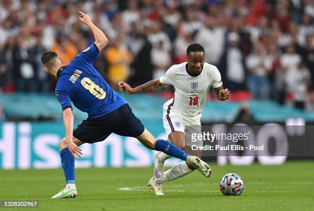 Raheem Sterling of England evades the tackle of Jorginho of Italy during the UEFA Euro 2020 Championship Final between Italy and England at Wembley...